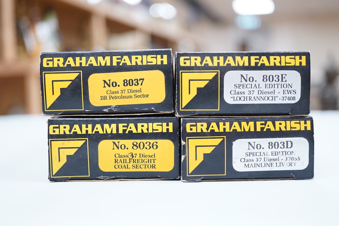 Four boxed Graham Farish N gauge railway Class 37 diesel locomotives; a BR Railfreight, 37 699 (8036), a BR Petroleum Sector, 37 887 (8037), a Mainline, 37055 (803D) and an EWS, 37408 (803E).